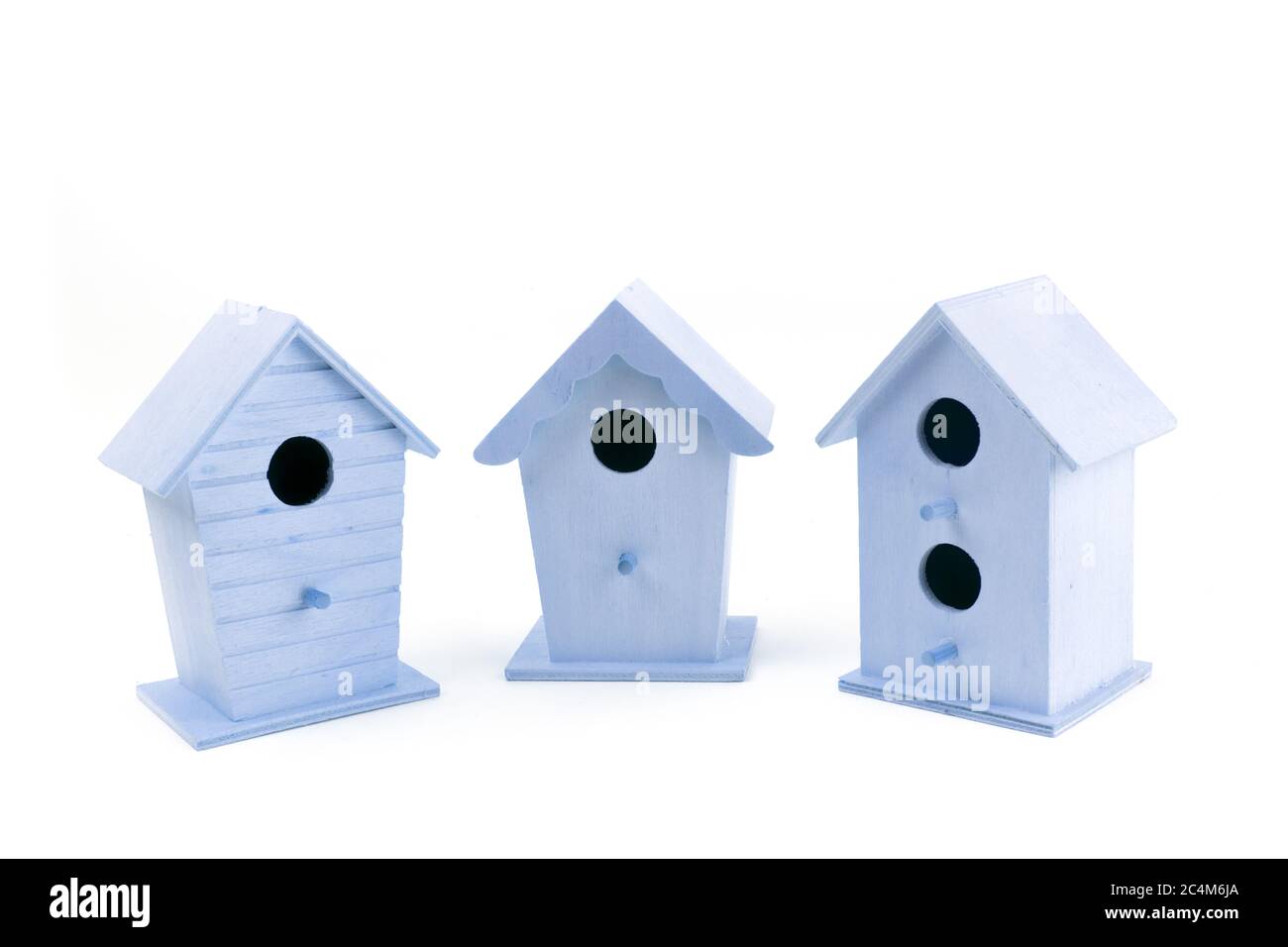 a row of bird houses representing the real estate market isolated on white Stock Photo Alamy