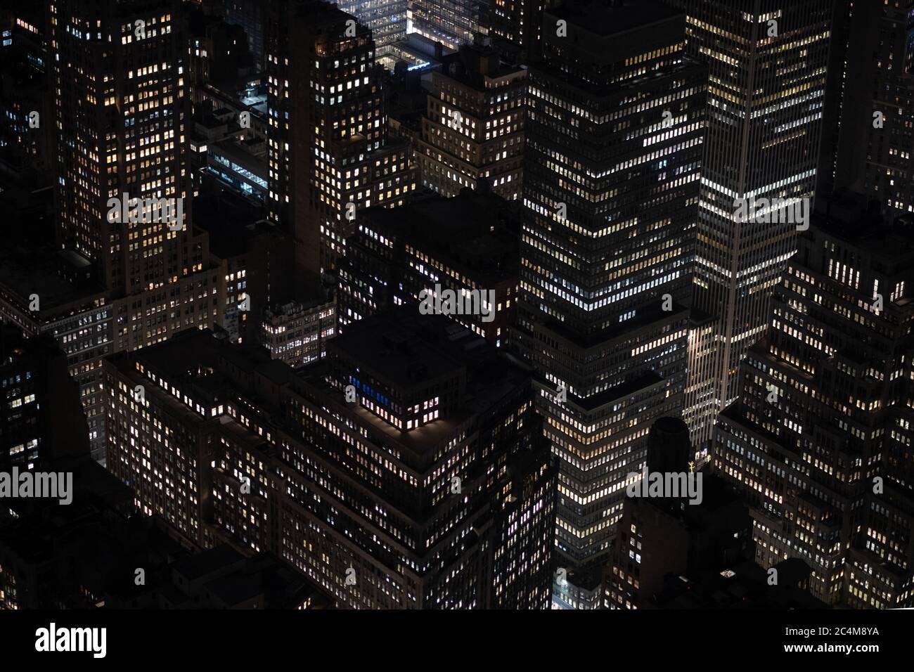 High angle shot of the beautiful lights on the buildings and skyscrapers captured at night Stock Photo