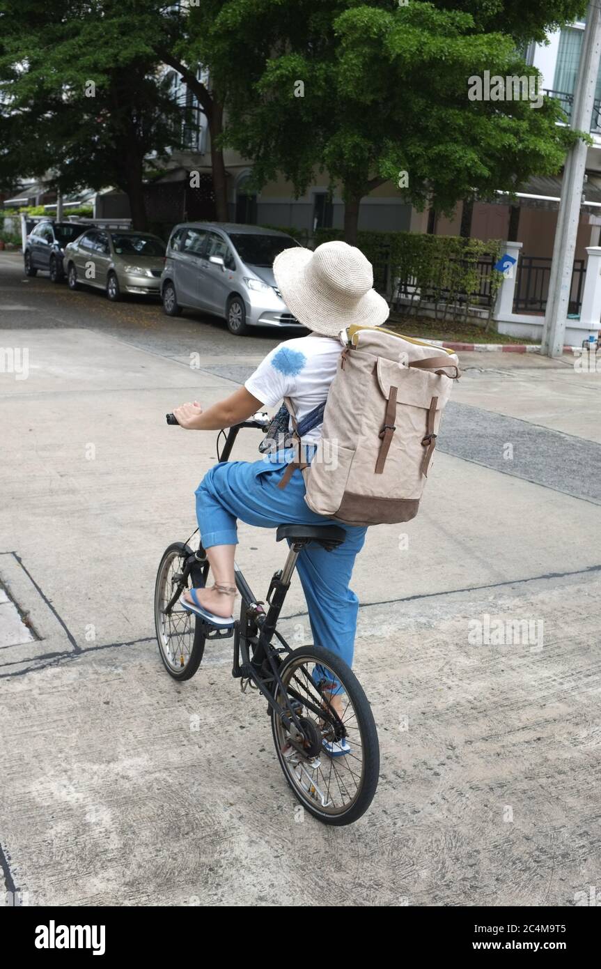 Woman riding black bicycle carrying boxes delivery service. Web banner design, bicycle club, Stock Photo