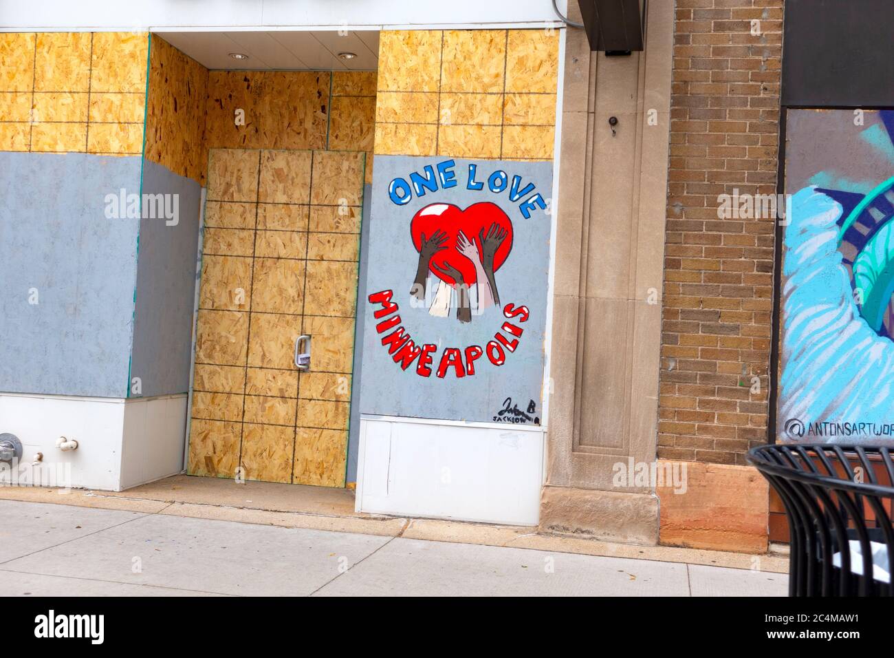 One Love Minneapolis on plywood boarded windows in the Uptown protest area. Minneapolis Minnesota MN USA Stock Photo