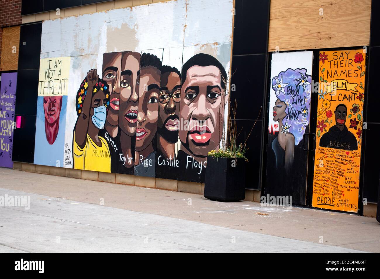 Portraits black people killed by police 'Melanin Garner Taylor Rice Castile Floyd' on plywood after George Floyd death. Minneapolis Minnesota MN USA Stock Photo