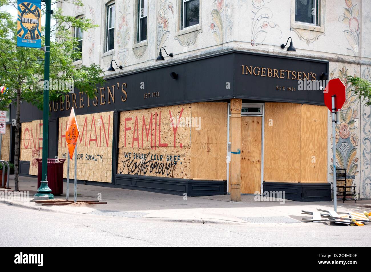 Ingebretsen's store on Lake Street boarded up saying 'One Human Family' Minneapolis Minnesota MN USA Stock Photo