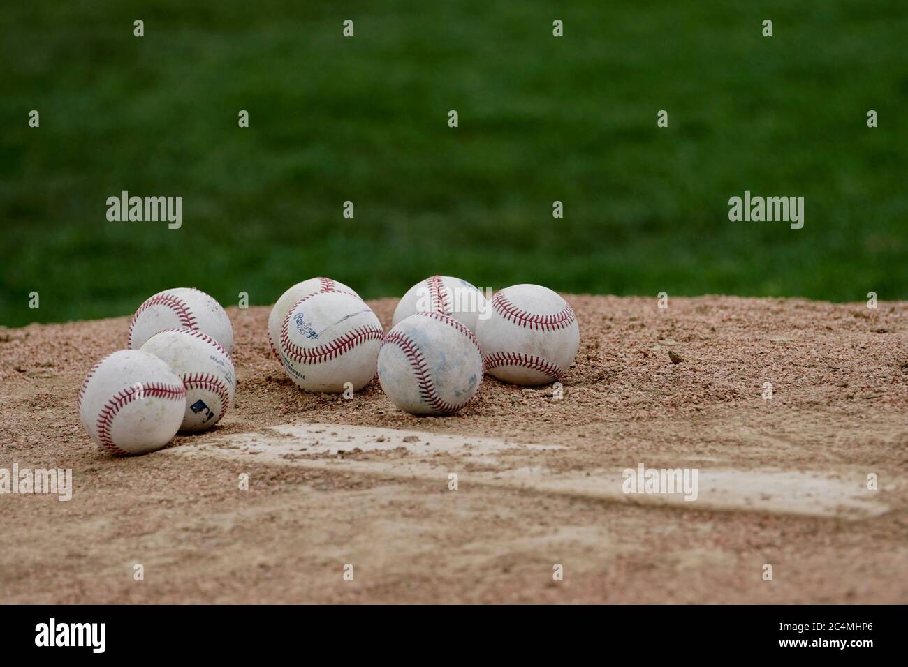 A collection of baseballs on the pitching mound. Stock Photo