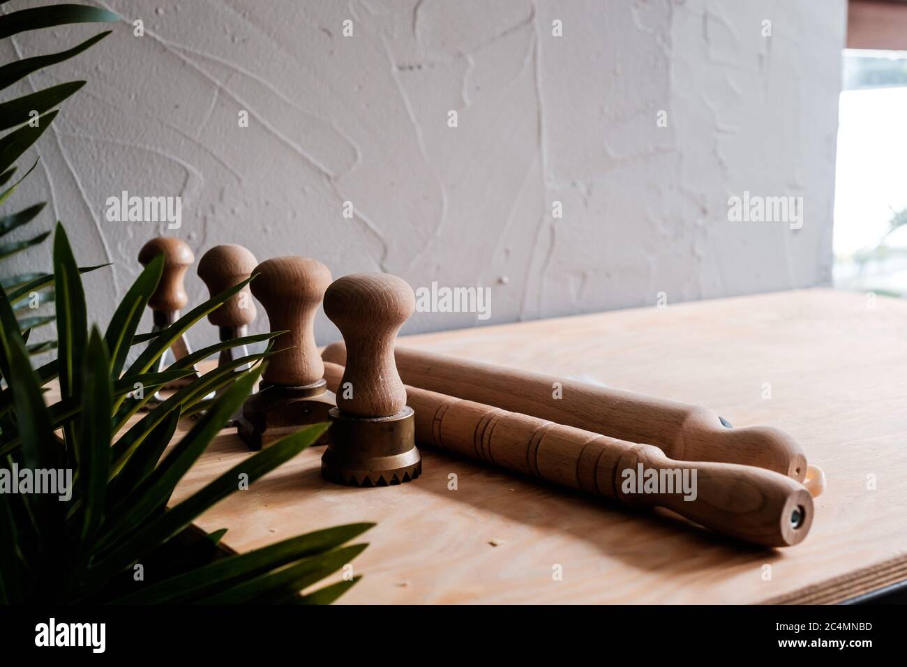 Picture of A set of pasta creating tools, including rolling pins and metal molds ...