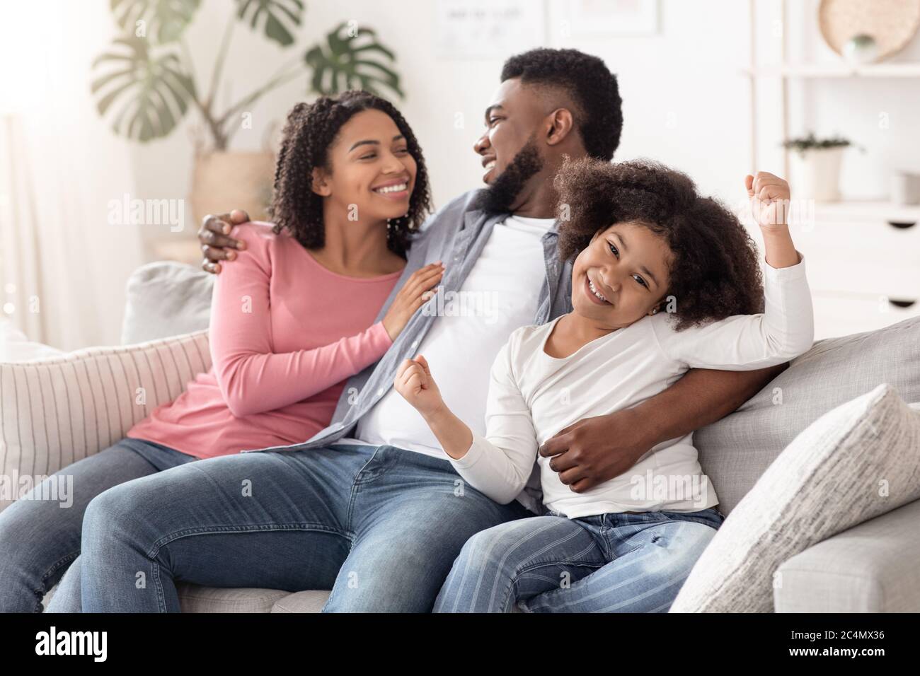Happy Black Couple Enjoying Time At Home, Hugging And Having Fun ...