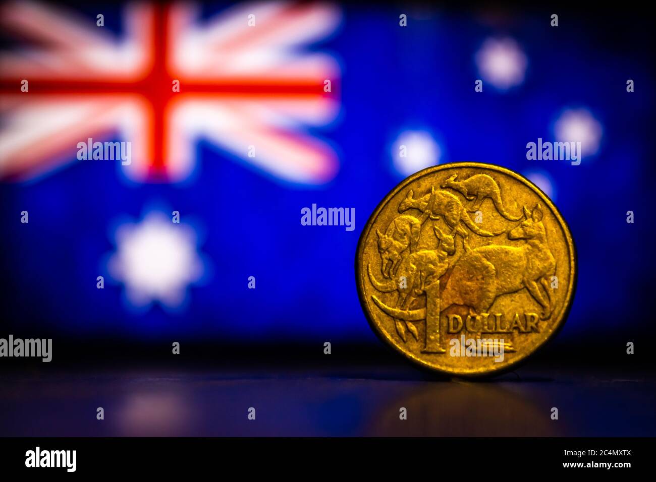 Australian Dollar Coin Isolated On Australia Flag Background With Space