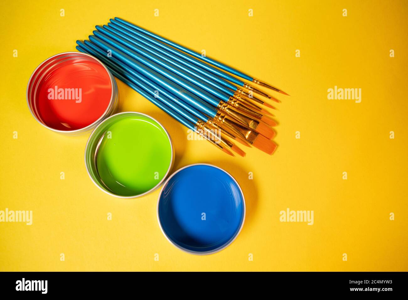 Primary colors in acrylic paint in metal tins still life art supply and