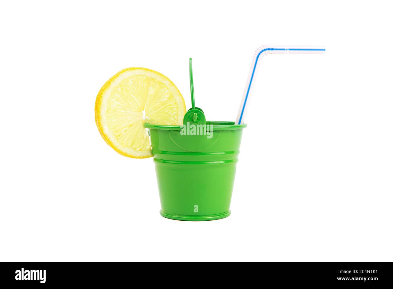 Closeup of a green water bucket with a lemon slice and a drinking straw isolated on white. Thirst-quencher for a hot summer. Stock Photo