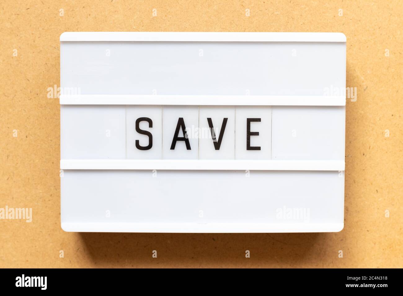Lightbox with word save on wood background Stock Photo