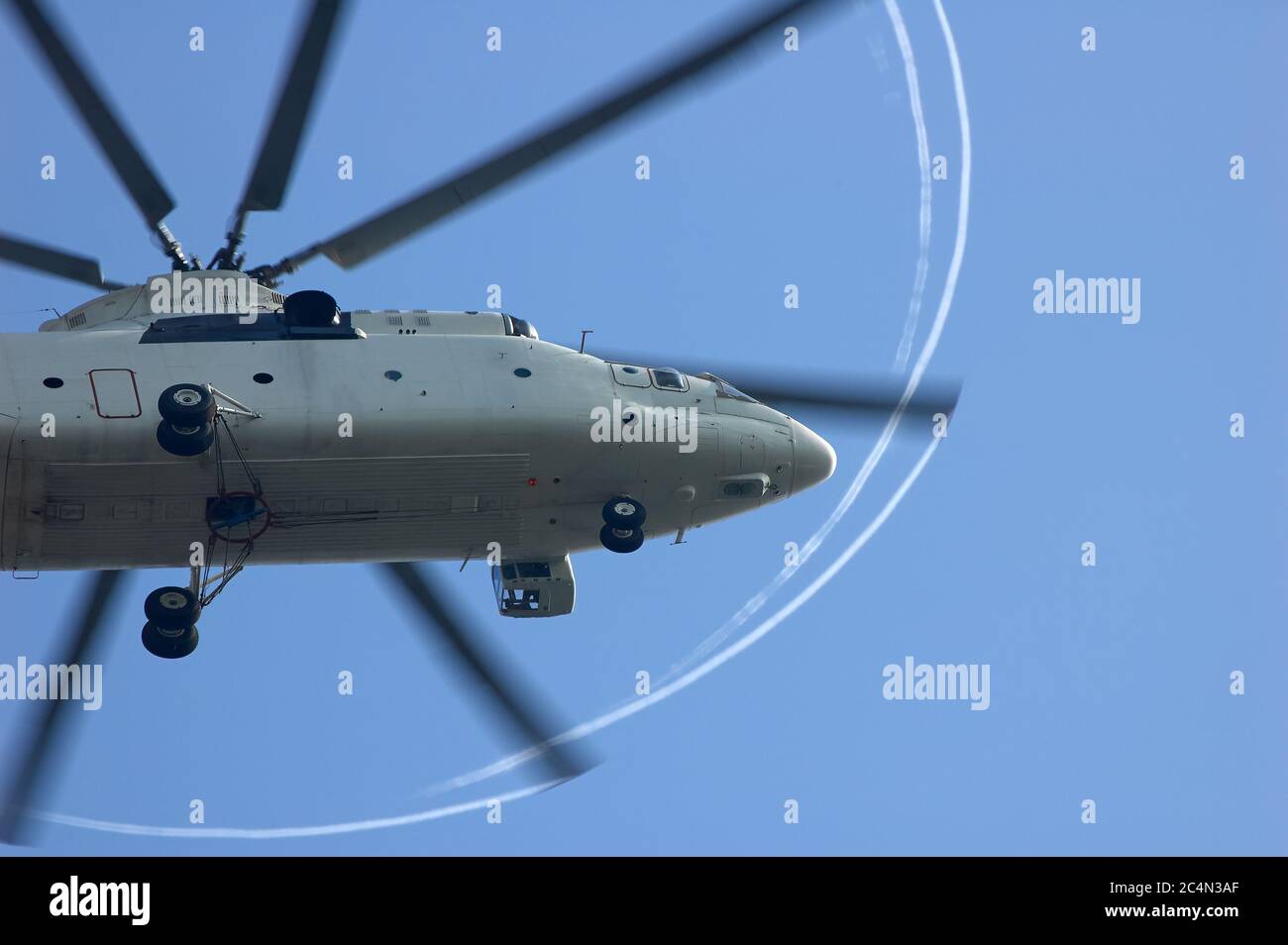 large helicopter with beautiful stripes of propellers in the air, view from the bottom Stock Photo