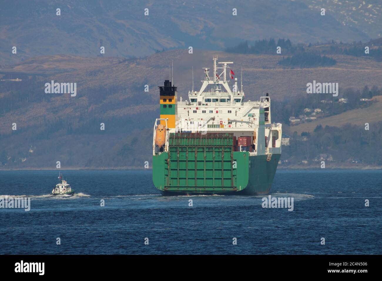 MV Hurst Point, a Point-class sealift ship operated by Foreland Shipping for the Ministry of Defence, taking on a pilot from Serco's SD Clyde Racer. Stock Photo