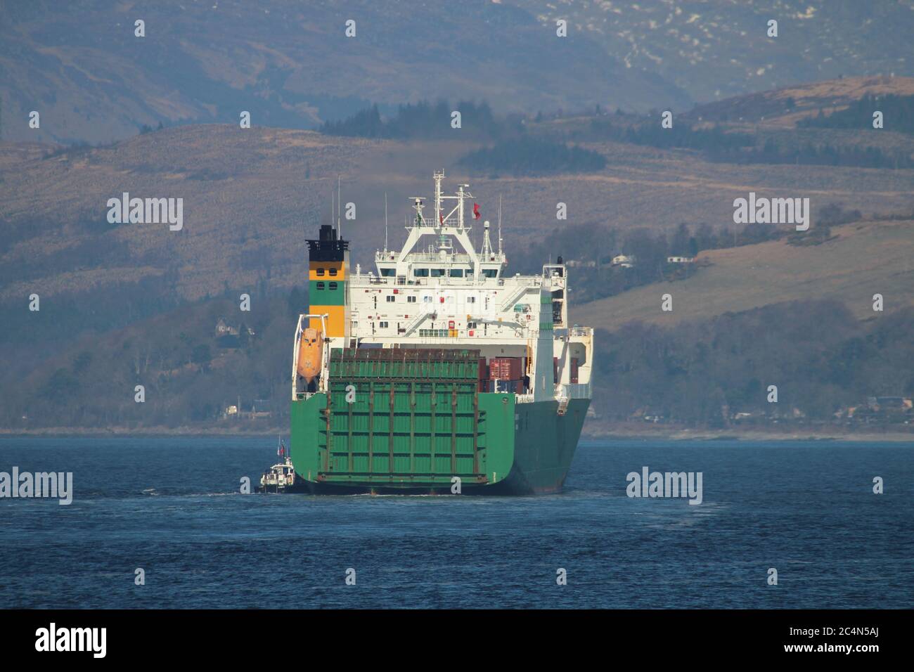 MV Hurst Point, a Point-class sealift ship operated by Foreland Shipping for the Ministry of Defence, taking on a pilot from Serco's SD Clyde Racer. Stock Photo