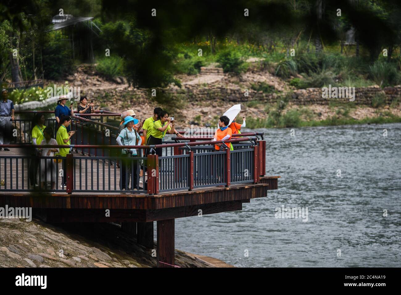Hangzhou, China's Zhejiang Province. 28th June, 2020. Tourists visit a scenic area on the Huyuan River in Huyuan Township of Fuyang District, Hangzhou, east China's Zhejiang Province, June 28, 2020. Township-level governments in Fuyang District have worked in collaboration to maximize the Huyuan River's ecological resources and promote local ecotourism. Credit: Xu Yu/Xinhua/Alamy Live News Stock Photo