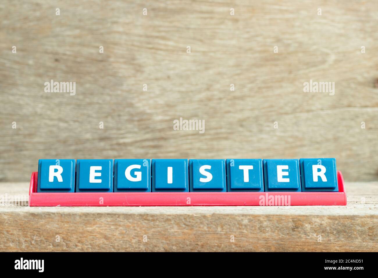 Tile letter on red rack in word register on wood background Stock Photo ...