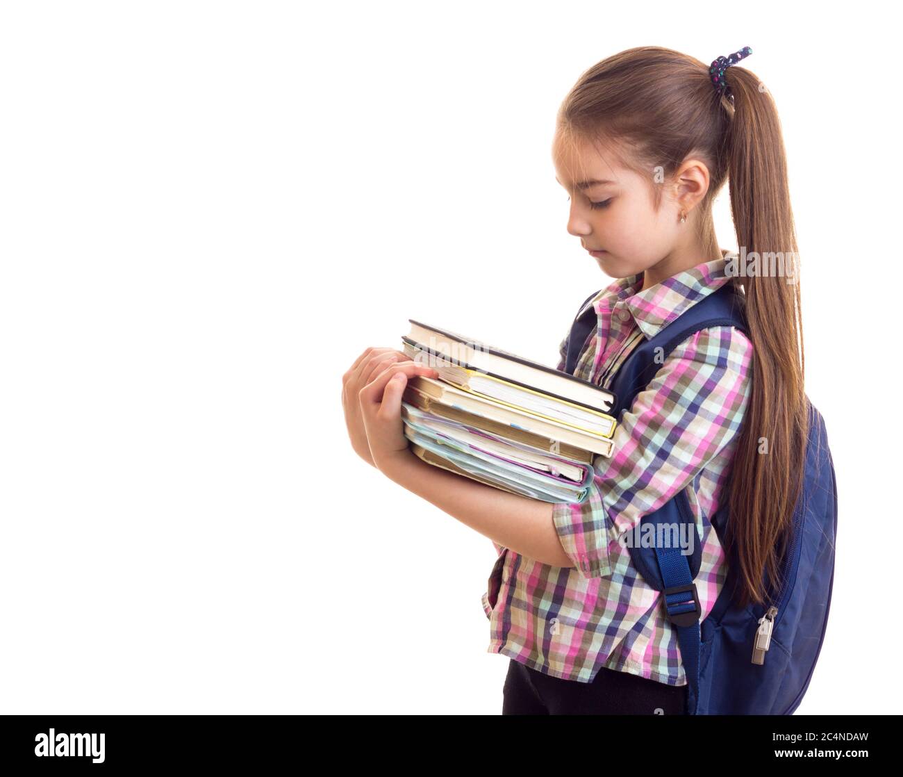 Schoolgirl with books at white isolated background Stock Photo - Alamy