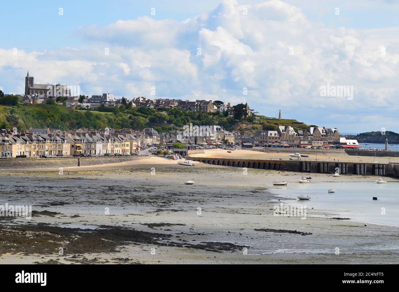 Cancale, France - June 10, 2011: Townscape of the city in Brittany with beach at low tide, preferred tourist destination and center for oyster Stock Photo