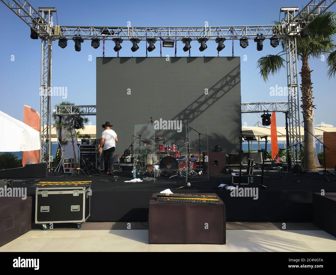 Open air show stage set up with led screen, sound and light system. Back  line with drums. Horizontal image Stock Photo - Alamy