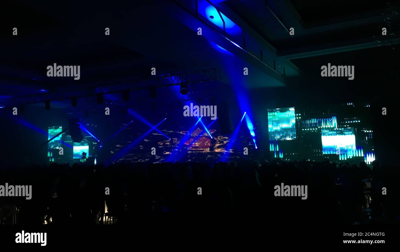 Big concert hall with a performance stage with led screen, sound and