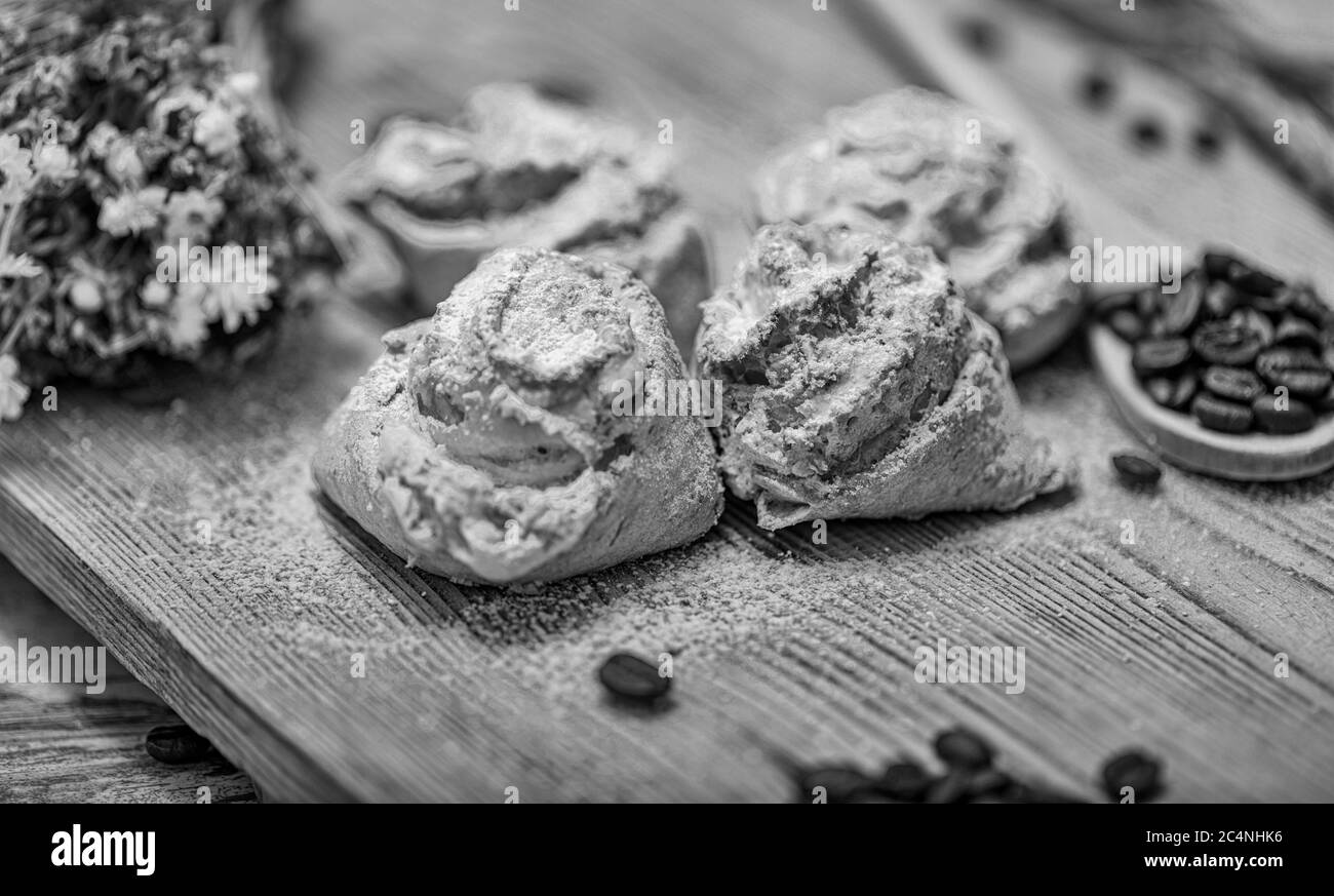 Natural baked coconut cookies or cocoanut macaroons on wooden plate. Homemade diet biscuits on rustic background. Stock Photo