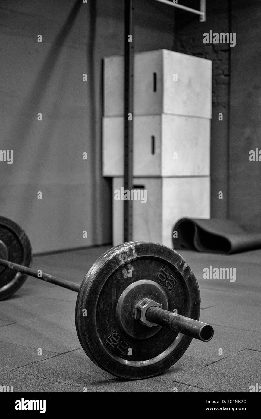 Fitness equipment for workout in Gym. Barbell with weights plate on