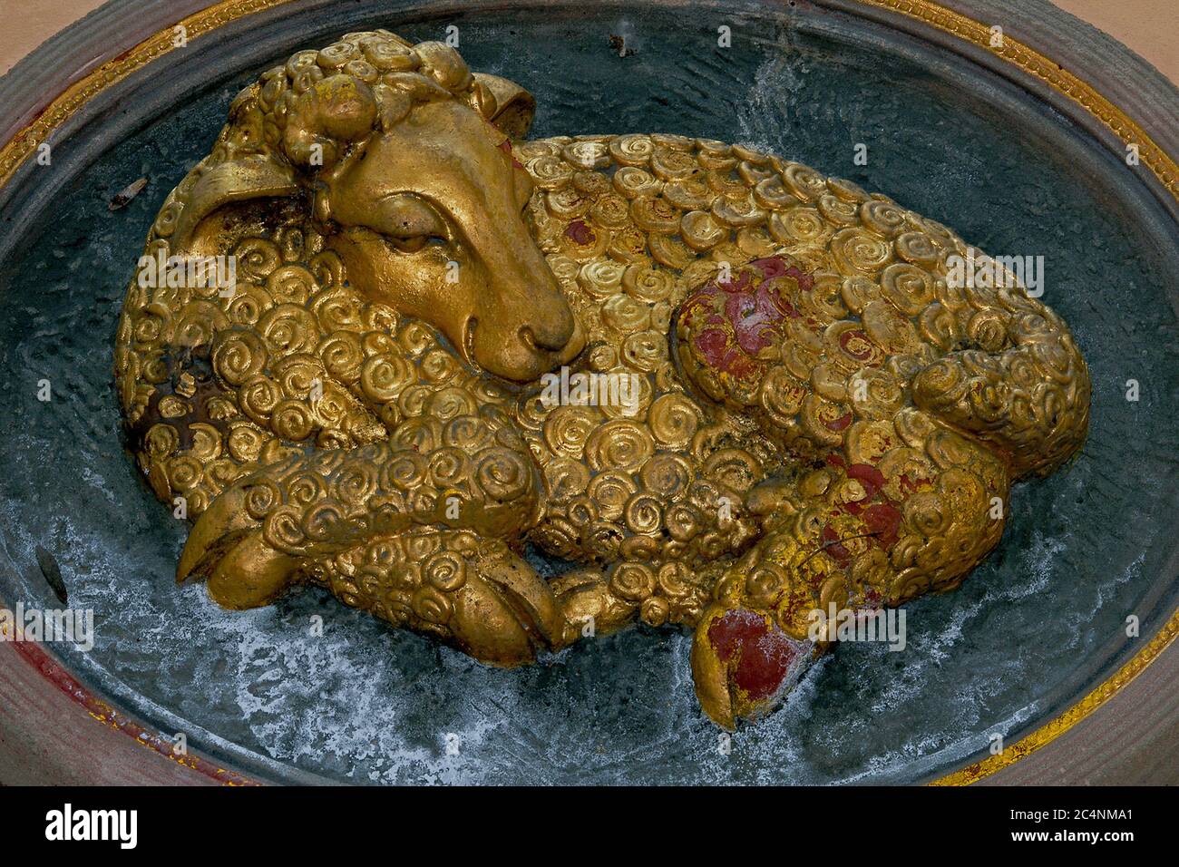 Gilded sleeping ram. Traditional house sign above the entrance to At the  Golden Ram, a former wool merchant's house in Nový Svět (New World), a  picturesque cobbled lane in the Hradčany district