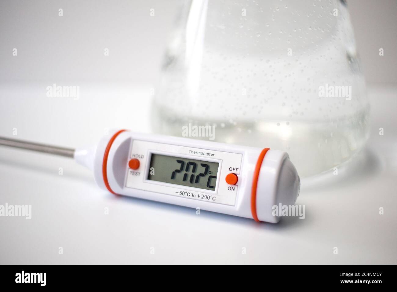 https://c8.alamy.com/comp/2C4NMCY/a-digital-thermometer-in-front-of-a-liquid-in-a-glass-erlenmeyer-flask-on-a-white-background-science-experiment-2C4NMCY.jpg