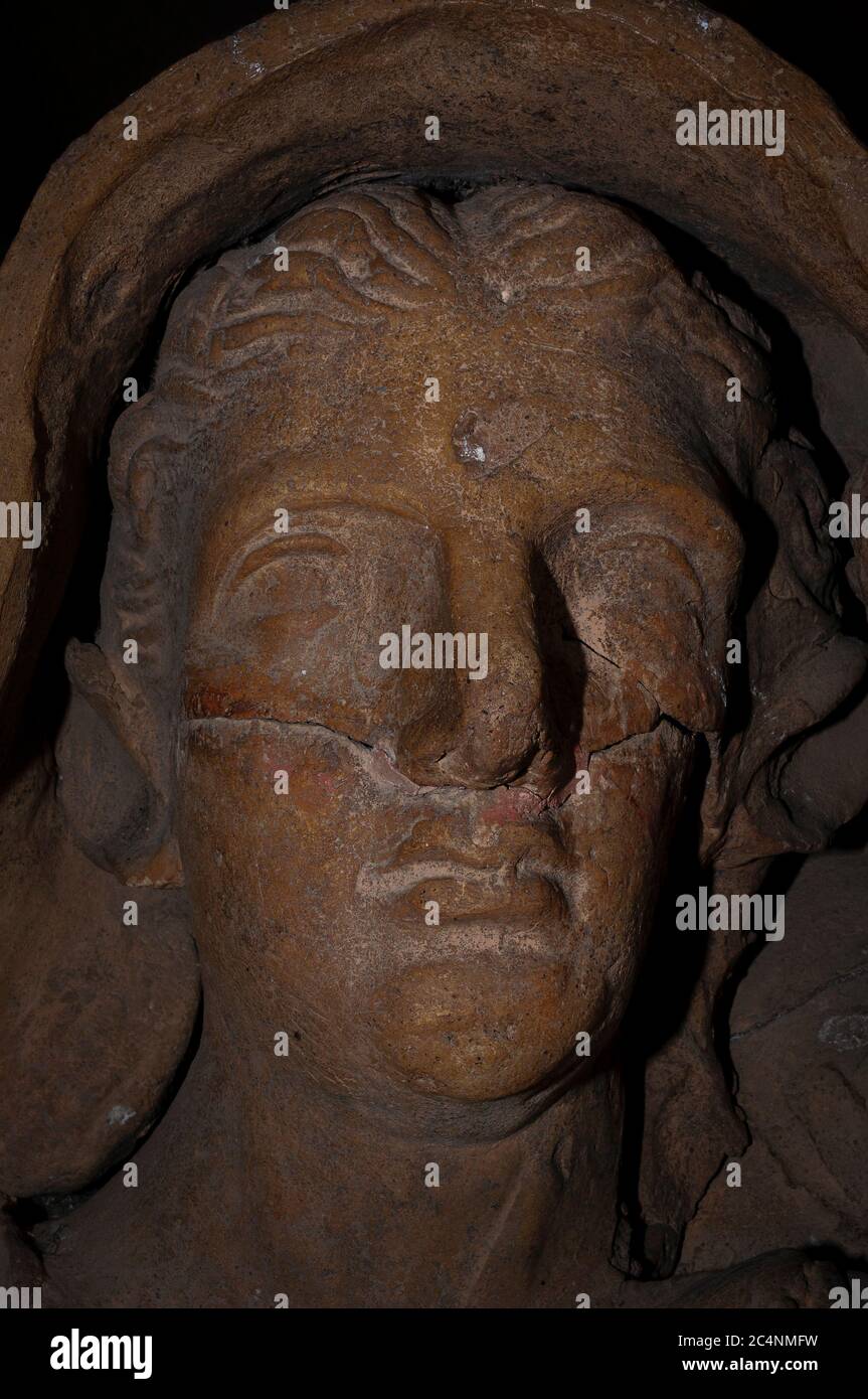 Face of Etruscan woman, interred more than 2,000 years ago.  Stone sculpture on Etruscan sarcophagus in archaeological museum at Tarquinia, Lazio, Italy. Stock Photo