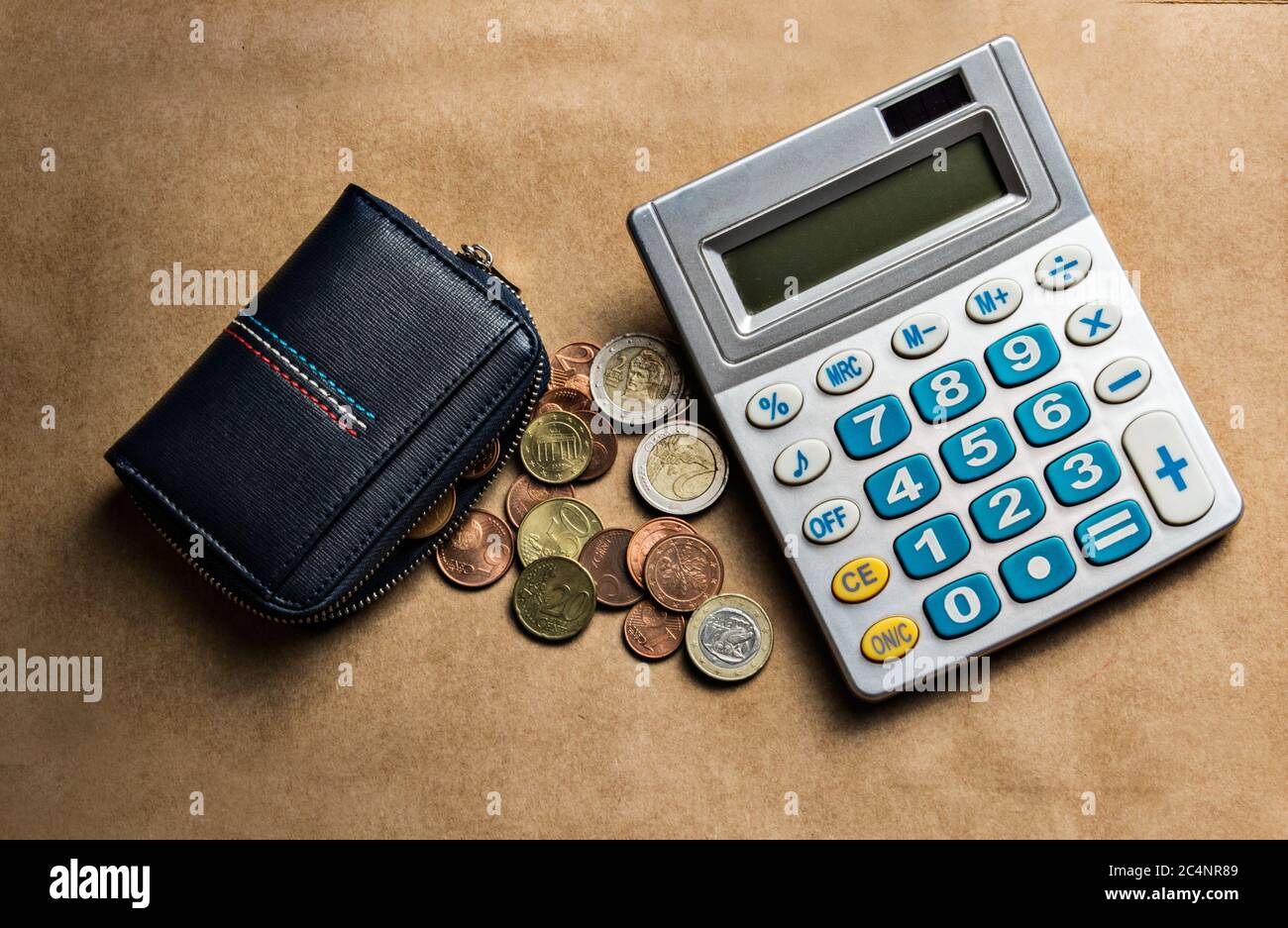 Personal finance control wallet with euro coins and calculator Stock Photo