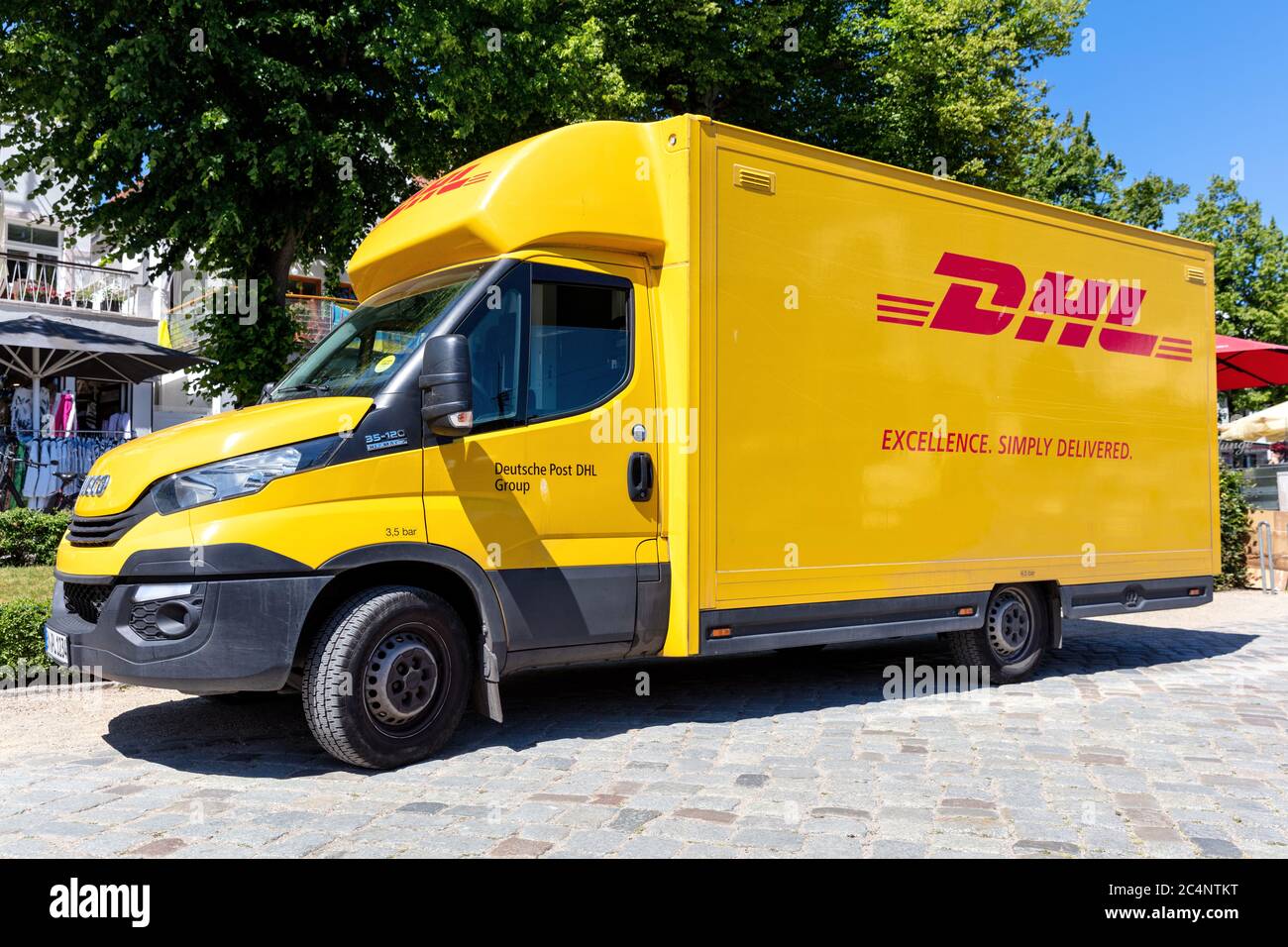 DHL delivery van. DHL is a division of the German logistics company Deutsche Post AG providing international express mail services. Stock Photo