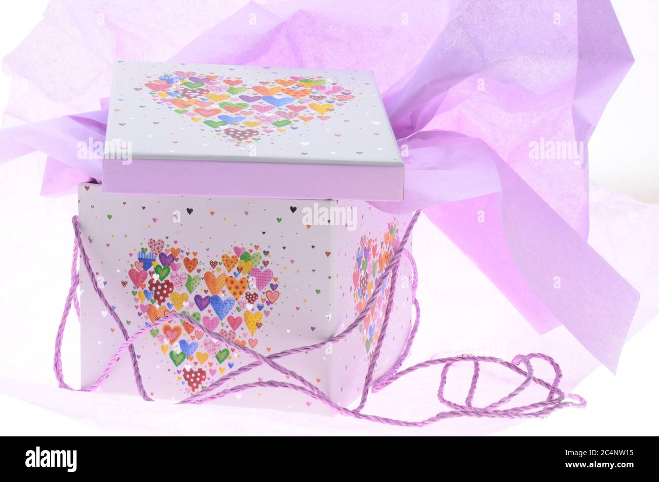Opend gift box with heart and wrapping paper Stock Photo