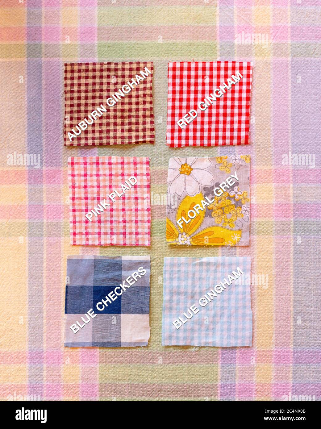 labeled fabric swatches red gingham grey flowers auburn gingham pink gingham big blue checks light blue gingham Stock Photo