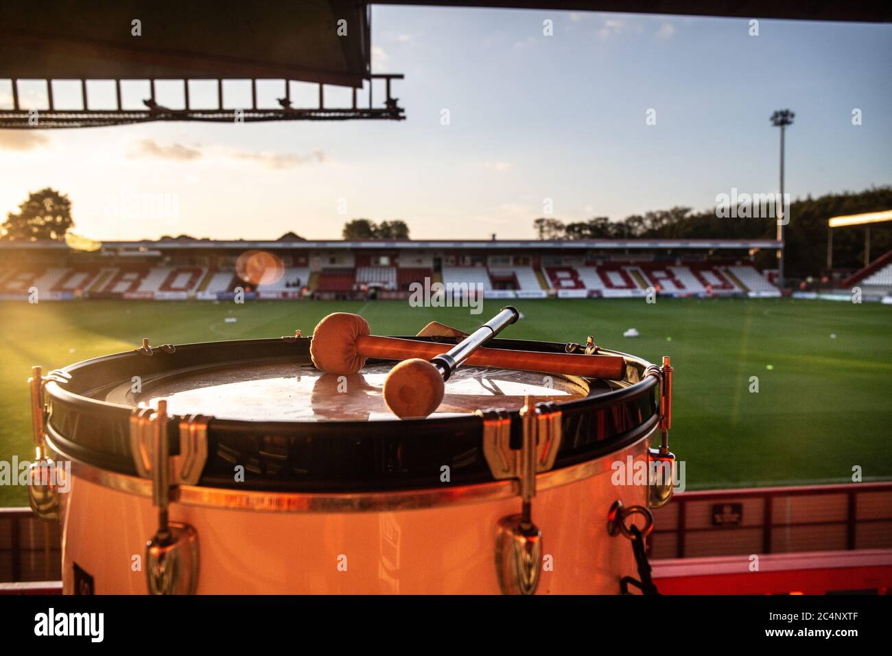View from empty standing terrace at football ground with drum in foreground Stock Photo