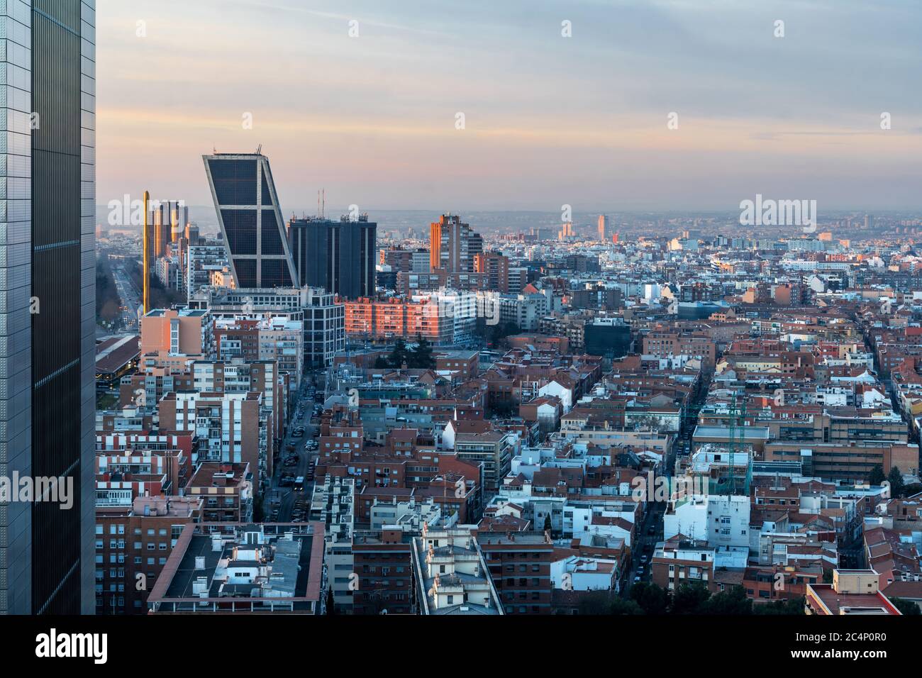 Aerial view of Castellana and Madrid's skyline at dawn, with the twin leaning modern office blocks (Puerta de Europa) in Plaza de Castilla to be recog Stock Photo