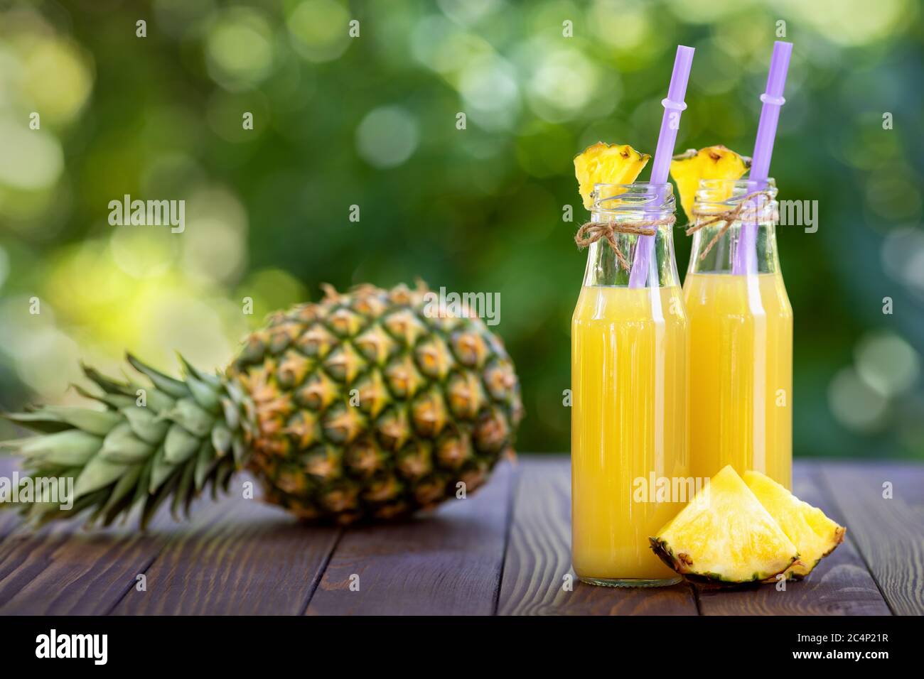 pineapple juice in glass bottles Stock Photo Alamy