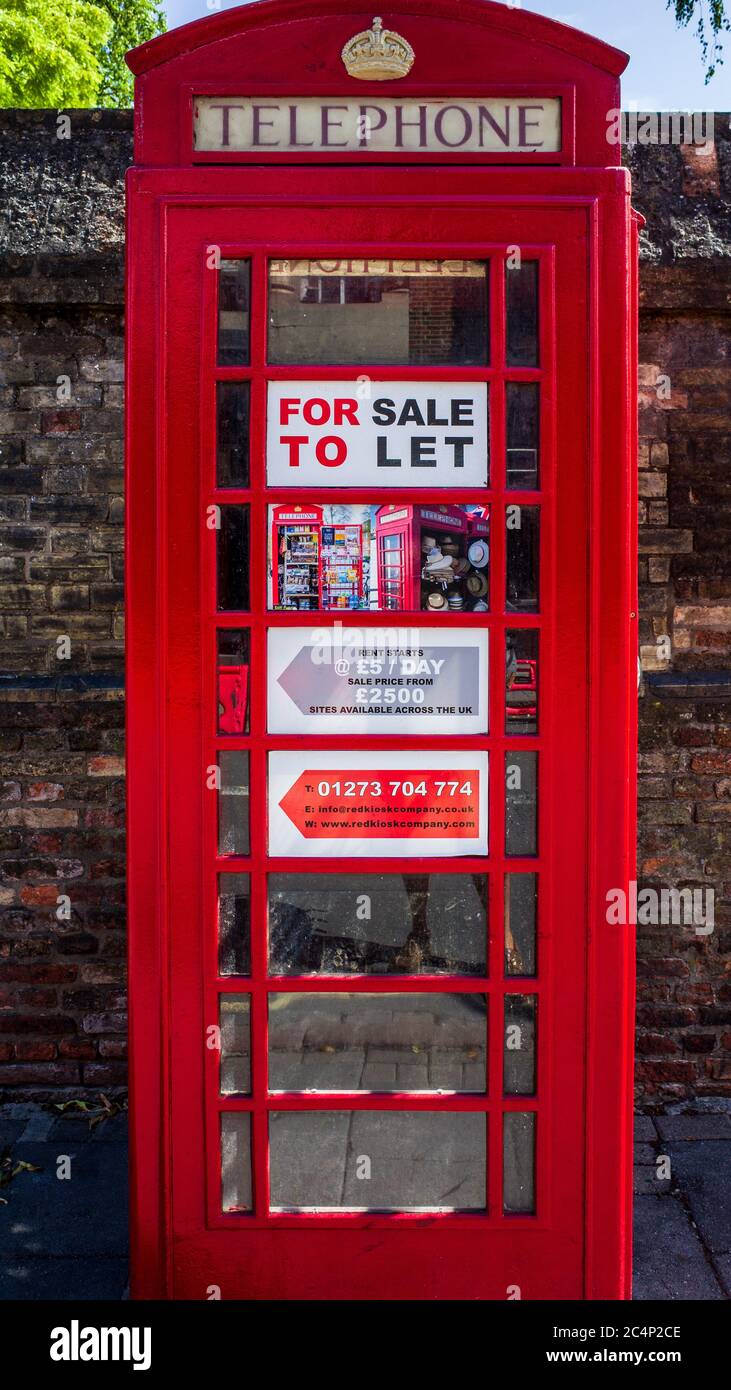Phone Box for Sale or To Let. Traditional Red British Telephone Box for Sale or To Let as a small business in Cambridge UK. Stock Photo