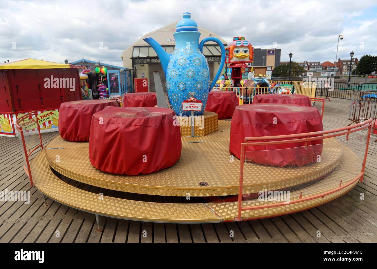 Closed fairground rides at Skegness beach as rain, wind and weather warnings are bringing an end to the sweltering June heatwave. Stock Photo