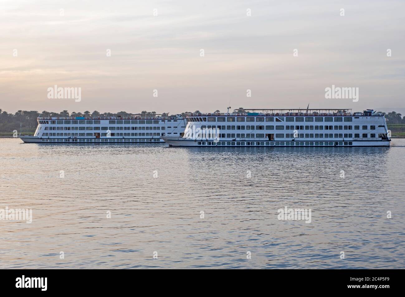 Pair of large luxury traditional Egyptian river cruise boat sailing on the Nile Stock Photo Alamy