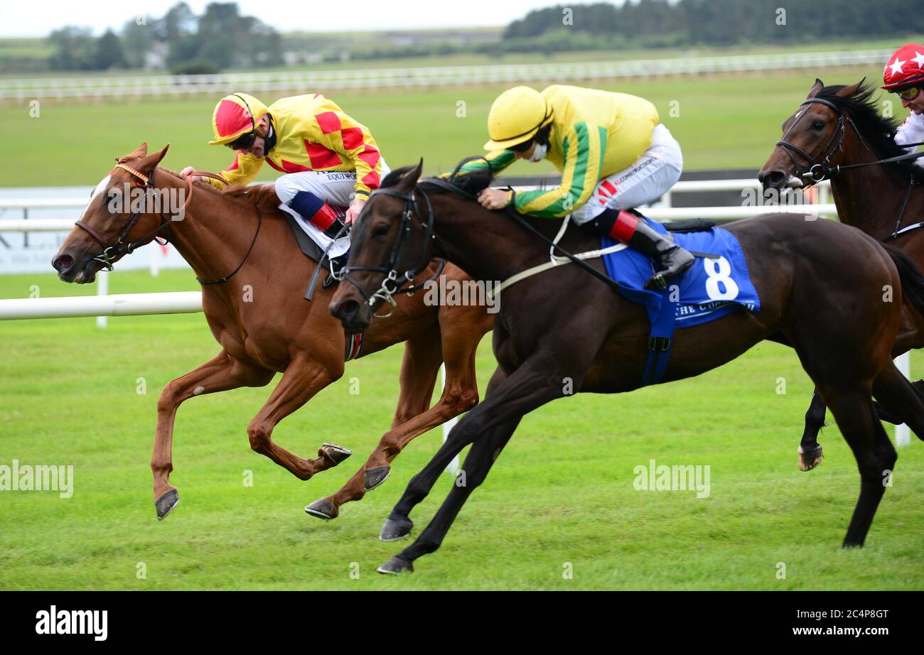 Aunty Bridy ridden by Kevin Manning (left) beats Sister Rosetta (right) to win the Irish Stallion Farms EBF Fillies Maiden at Curragh Racecourse. Stock Photo