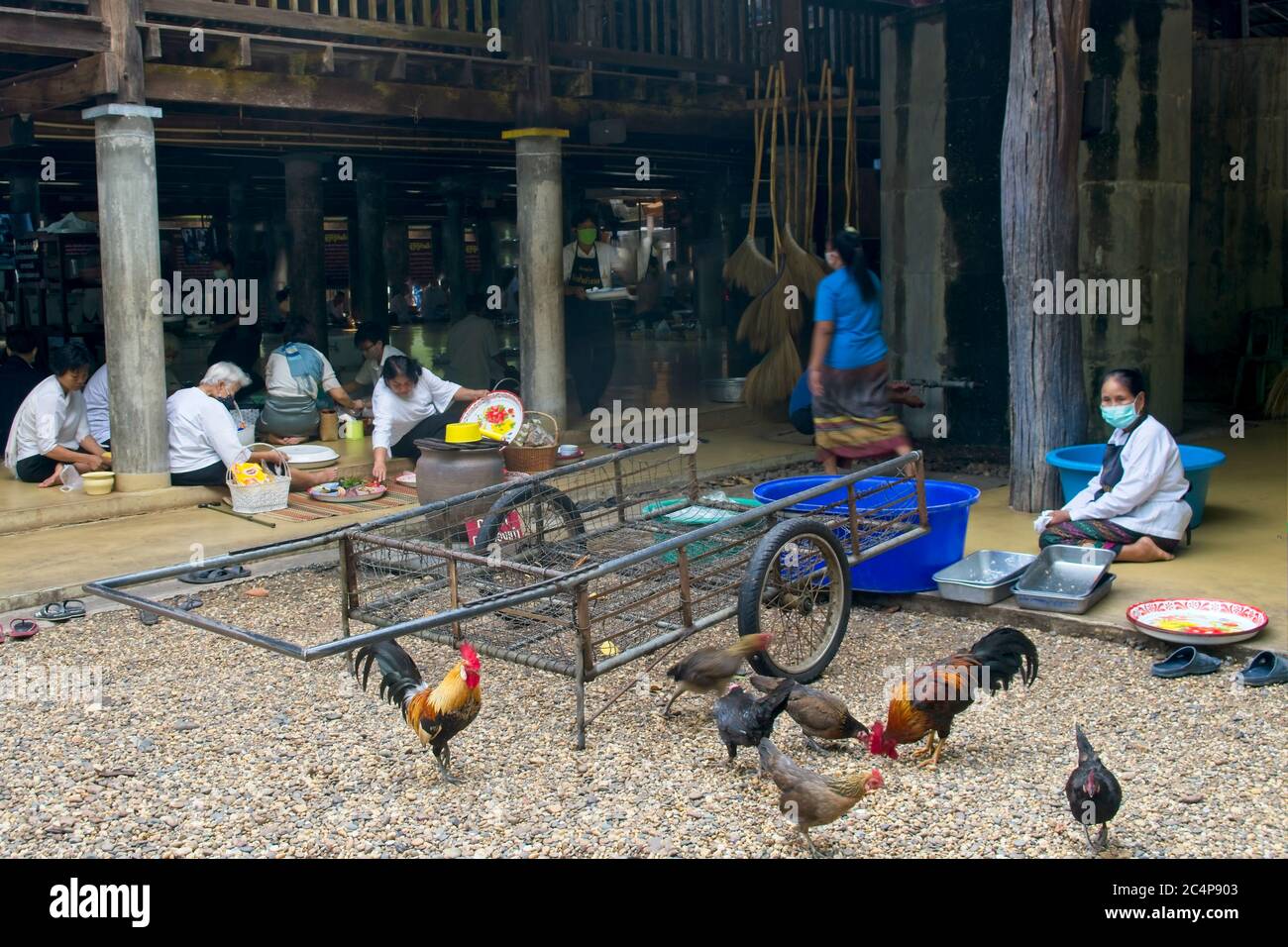 Celebrating Buddhist Monks' Day. Temple surroundings people sitting ...