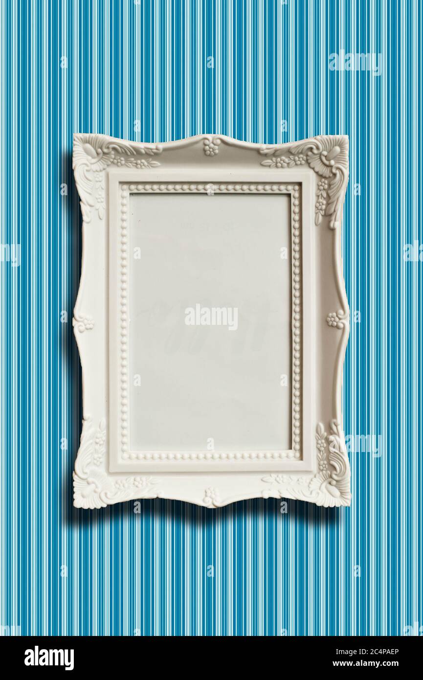 classic white blank frame on a wallpaper background Stock Photo