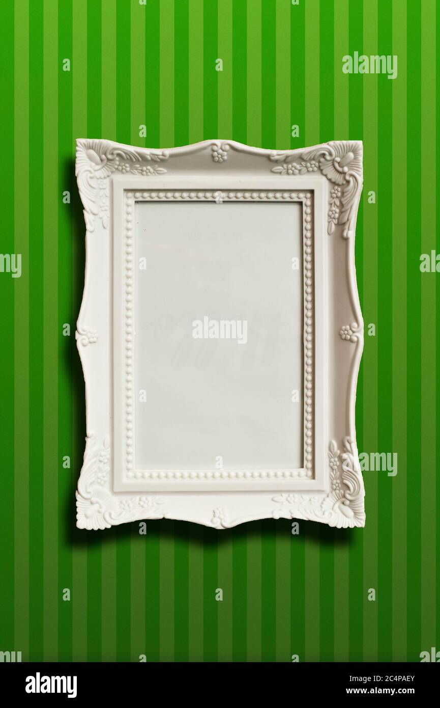 classic white blank frame on a wallpaper background Stock Photo