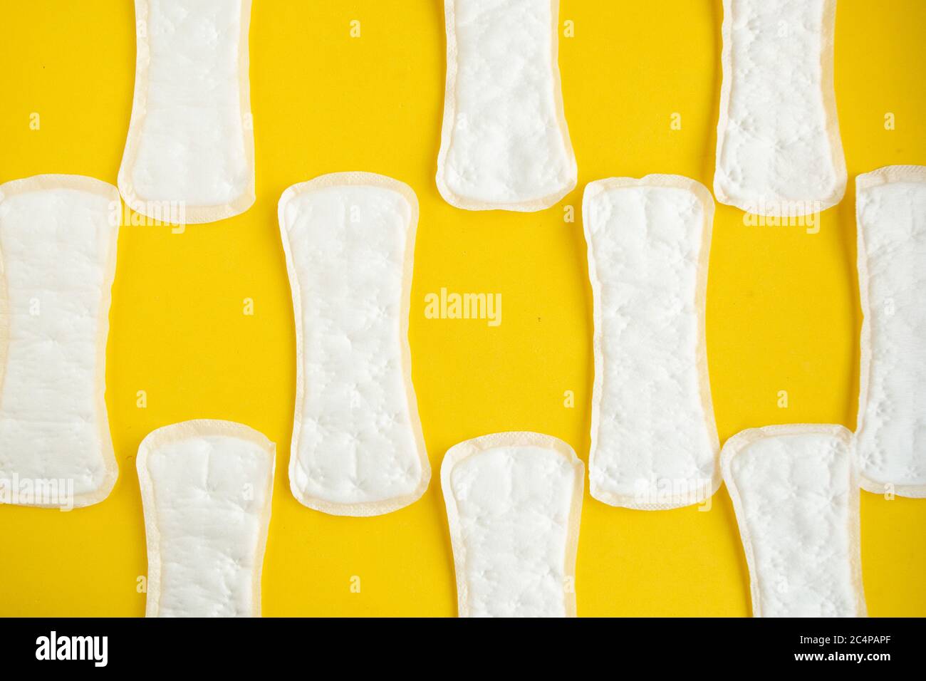 sanitary napkin pattern on yellow background, top view Stock Photo Alamy