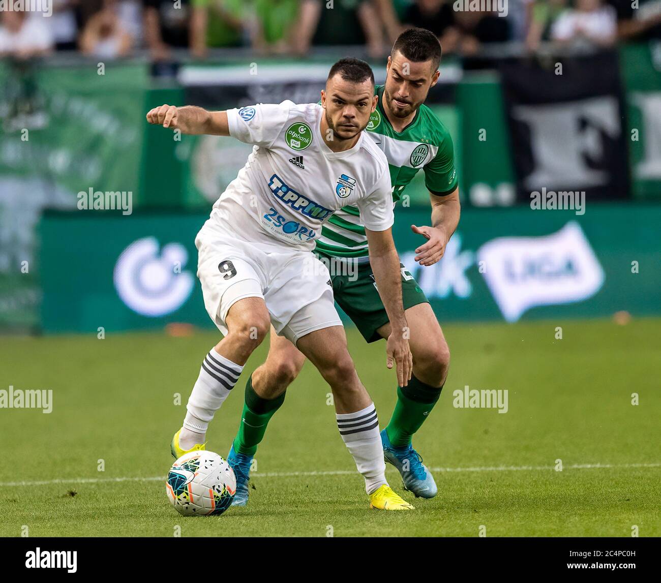 (r-l) Isael da Silva Barbosa of Ferencvarosi TC challenges Dzenan