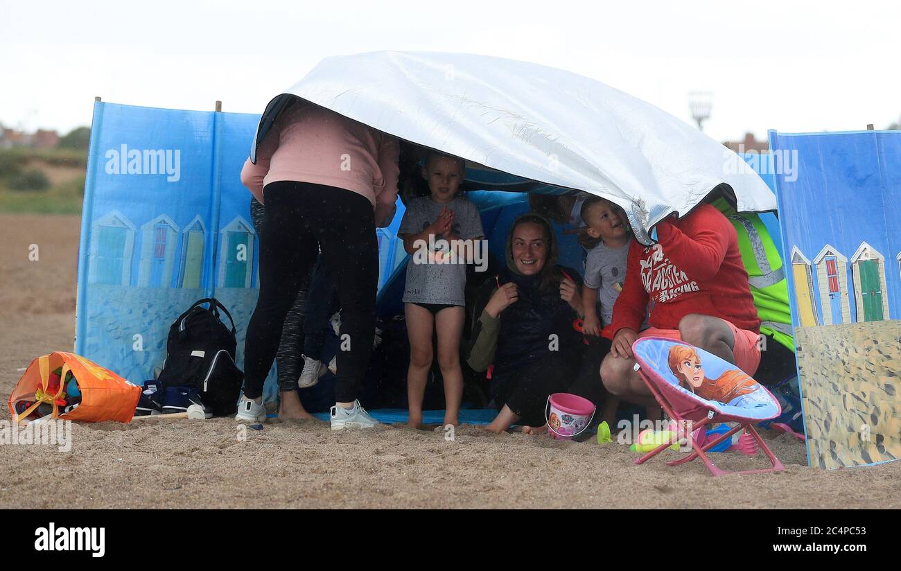 Beach Goers Brave The Weather On Skegness Beach As Rain Wind And Beach Goers Brave The Weather On Skegness Beach As Rain Wind And