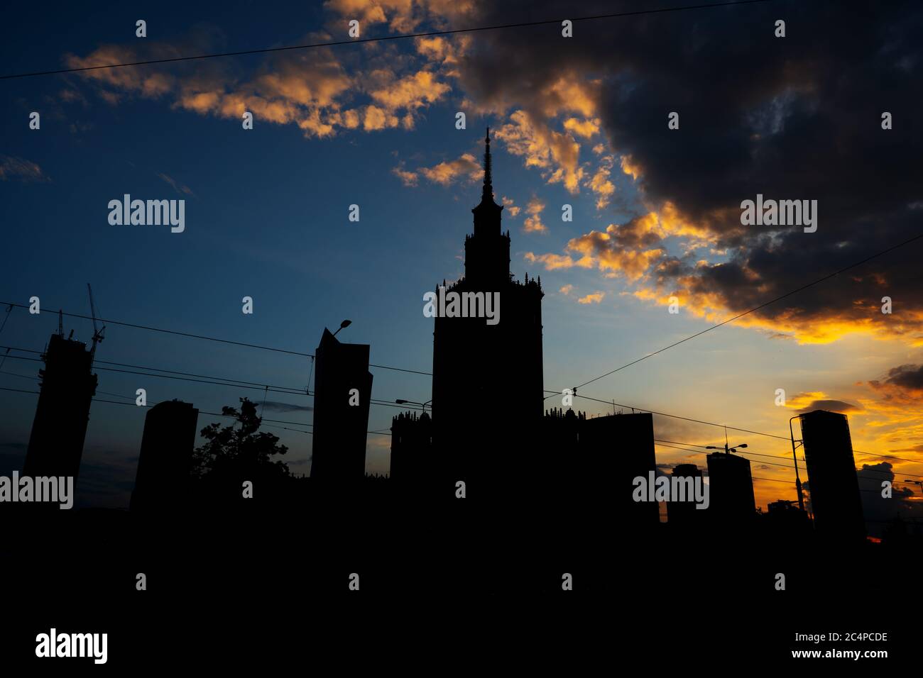 Silhouette of Warsaw city downtown skyline against sunset sky, capital ...