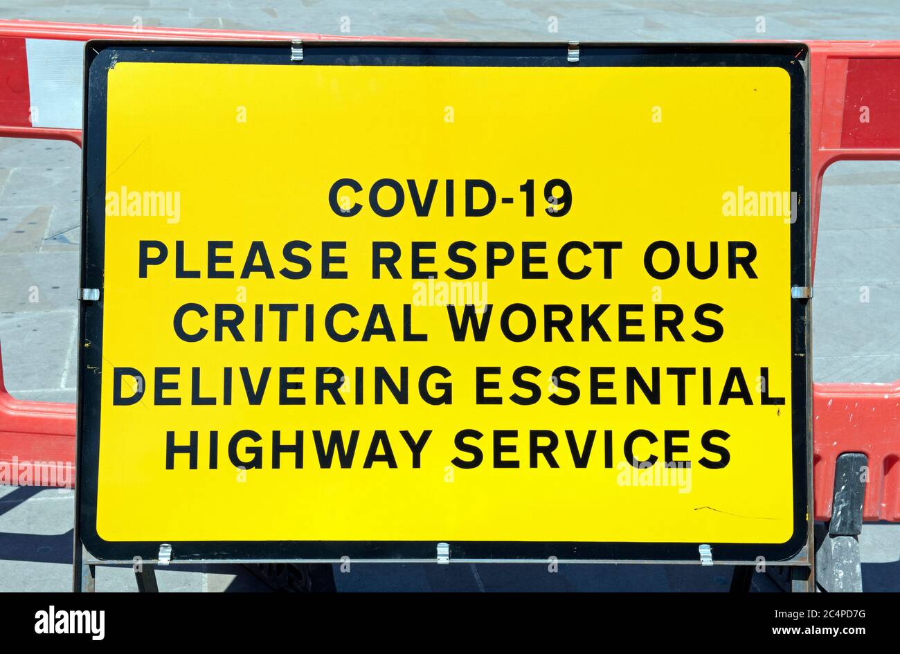 Coronavirus Corvid 19 sign or notice asking for respect for critical worker delivering essential highway services Highbury Corner Islington London UK Stock Photo