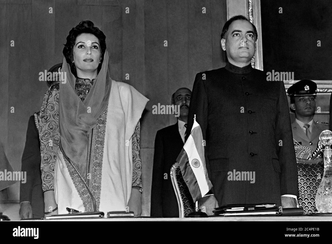 Pakistan Prime Minister Benazir Bhutto, left, and Indian Prime Minister Rajiv Gandhi stand together during the start of the fourth SAARC Summit meeting December 29, 1988 in Islamabad, Pakistan. The gathering of South Asian leaders includes Pakistan, India, Bangladesh, the Maldives, Sri Lanka, Bhutan and Nepal. Stock Photo