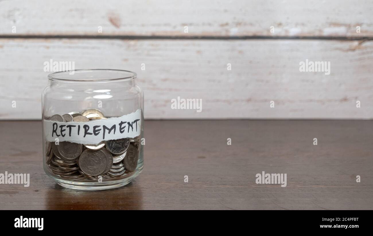 Save money for retirement concept with glass jar and coins Stock Photo