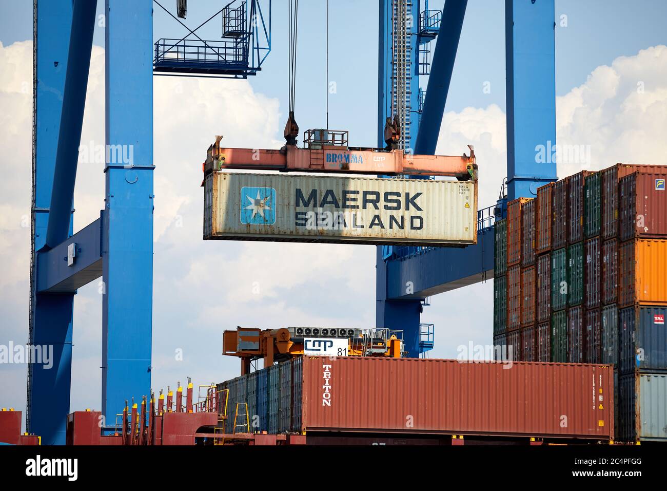 Maersk Sealand shipping container lifted by shiptoshore crane