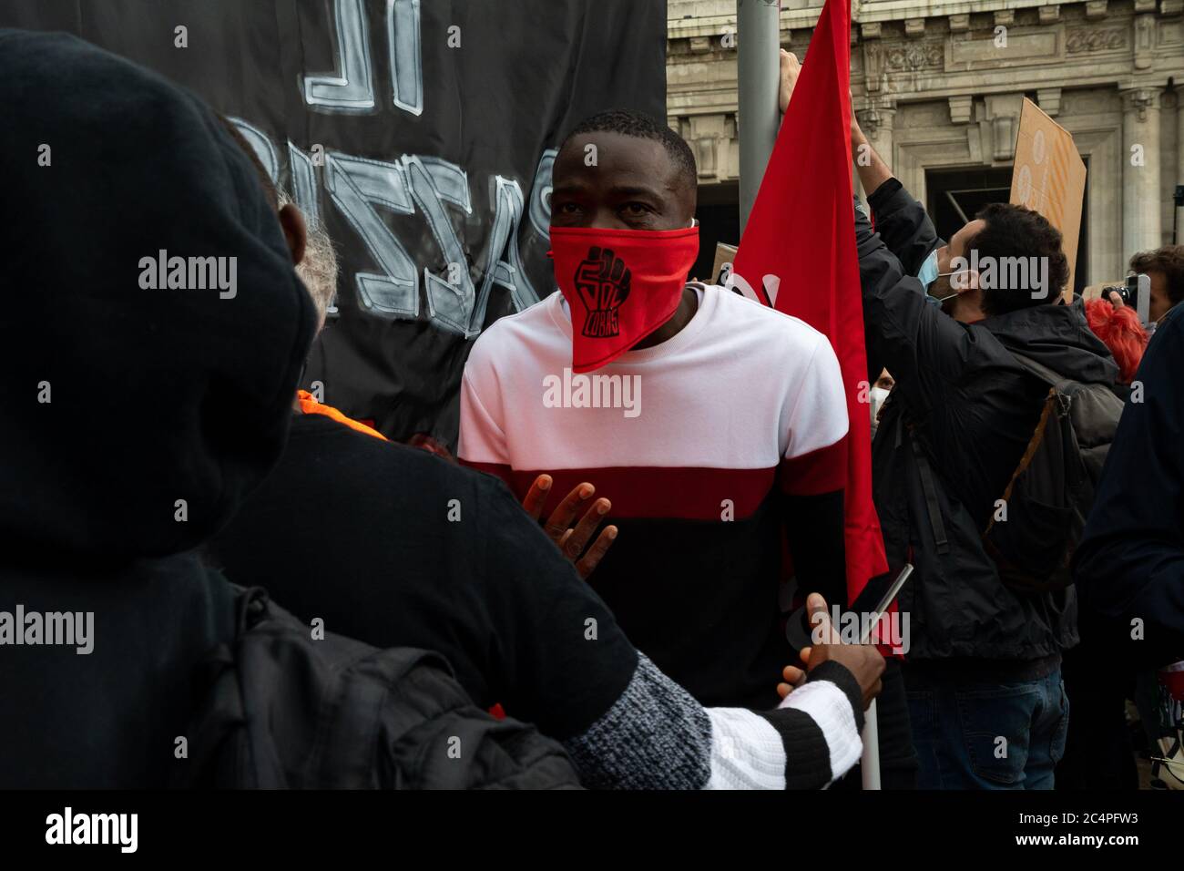 Member of the Italian trade union named 'Cobas' interviewed during the protest assembly in solidarity to Black Lives Matter (BLM) movement. Stock Photo